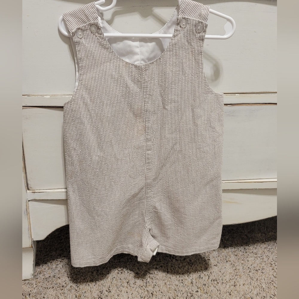 Tan and white boy shortall